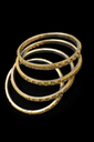 Elegant gold-tone stone bangles stack.png