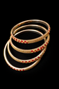 Elegant red and gold bangles.png